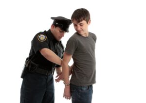 young teenager getting handcuffed will call a lawyer on Long Island, NY