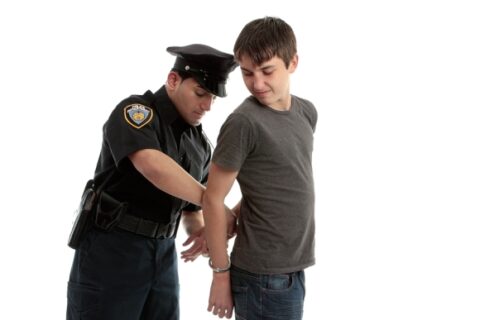 young teenager getting handcuffed will call a lawyer on Long Island, NY